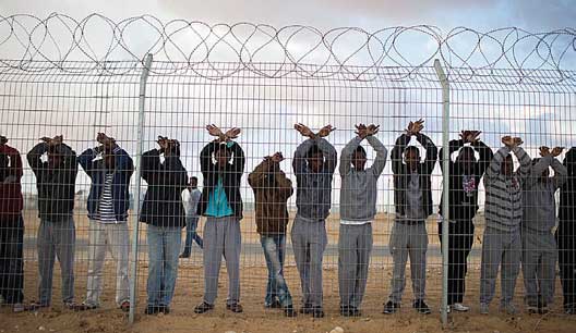 African asylum seekers take part in a day of protest at the Holot detention center in Israel’s southern Negev desert, Feb. 17, 2014. (Ilia Yefimovich/Getty Images)