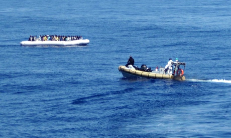 A picture released by the Italian navys shows migrants being rescued off the coast of Sicily