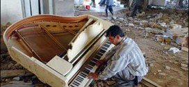 Iraqi man playing piano in middle of destruction (2003)
