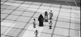 A female employer and her children are accompanied by their domestic worker, back right, as they walk through The Avenues, an indoor luxury shopping center in Kuwait City.  © 2010 Moises Saman/Magnum Photos