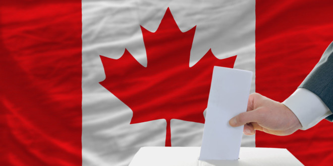 man-putting-ballot-in-a-box-during-elections-in-canada